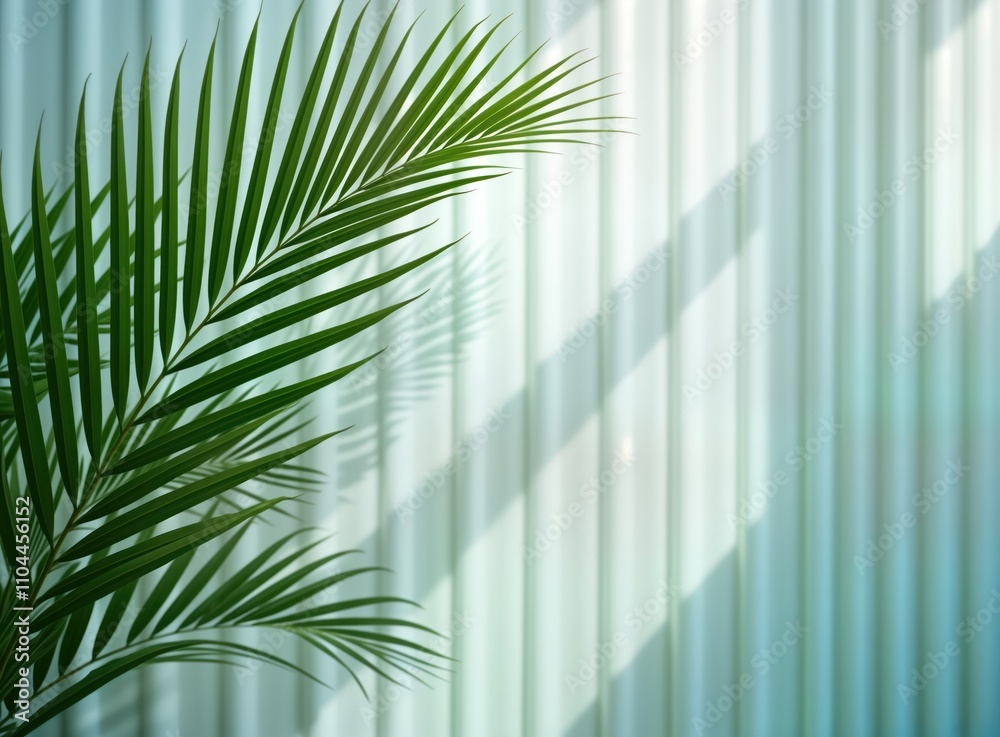 Leinwandbilder green palm leaves cast soft shadows on white sheer curtain. sunlight filters through translucent fab
