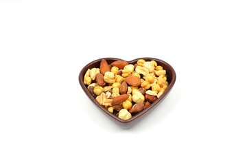 mixed nuts in bowl. Mix of various nuts on white background.