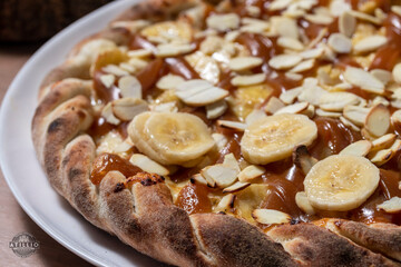 Banana pizza with dulce de leche and nuts