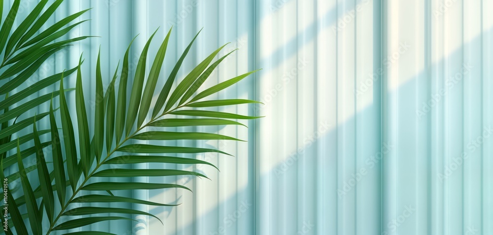 Poster green palm leaves against light teal reeded glass wall. sunlight creates soft shadows on surface. tr
