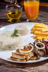 steak, pork and chicken with fries and rice