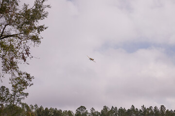 Aerial crop dusting with a plane on adjacent farm land in mid November!