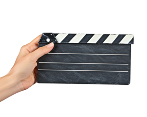 a hand holding a clapper board