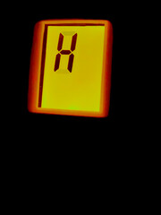 high heat indicator letter H digital display metaphor for safety climate change tensions weather isolated on a black background 