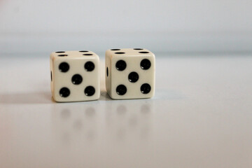 close-up of two die five dice. fifty-fifty or 10. image for Rule of 55 early retirement planning themes or games  game night entertainment. isolated on a white background 