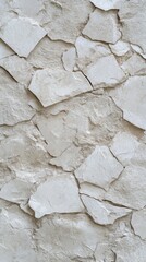 Rusty border meeting a white wall produces an intriguing texture contrast that highlights the passage of time and the details of weathering.