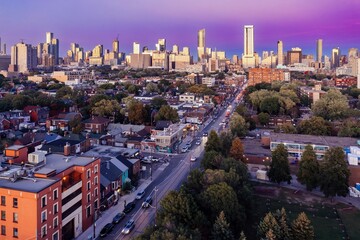 Toronto downtown city skyline and morning traffic on Dundas St W at sunset, Ontario, Canada.