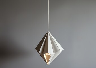 Fototapeta premium White geometric lamp, suspended against neutral gray backdrop, architectural lighting design