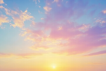 Fototapeta premium Dreamy pastel sunset sky with soft pink and orange clouds glowing above a tranquil horizon, perfect for serene landscape designs, inspirational backgrounds, and natural beauty themes.