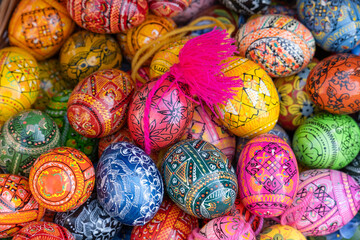 Colorful Easter eggs decorated with traditional patterns serve as festive decorations during the Easter season, symbolizing celebration and renewal