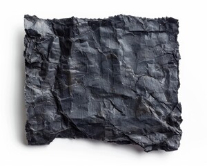 A crumpled black paper sheet with a textured surface, showcasing deep shadows and highlights.