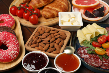 Different tasty food served for brunch on wooden table