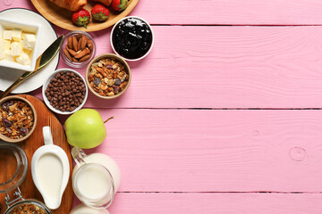 Different tasty food served for brunch on pink wooden table, flat lay. Space for text