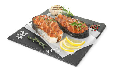 Tasty grilled salmon steak with spices isolated on white