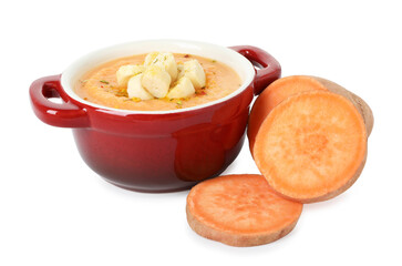 Delicious sweet potato soup with croutons and fresh vegetable isolated on white