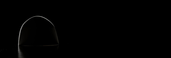 3d rendering of traditional Albanian felt hat in low key light