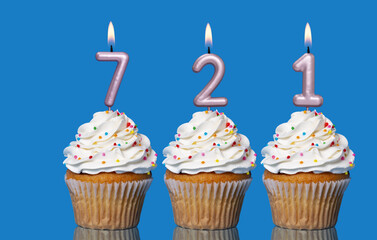 Birthday Cupcakes With Candles Lit Forming The Number 721
