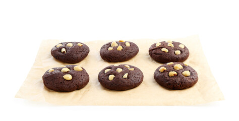 Tasty chocolate cookies with hazelnuts isolated on white