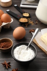 Baking powder and other products on grey wooden table