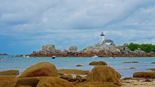 Small motor boats and yachts anchored in the bay, Phare de Pontusval, Brittany, France