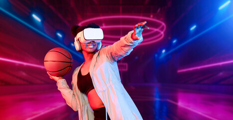 Basketball player holding basketball hologram at futuristic sport arena. Energetic athlete or sport...