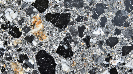Granite texture featuring speckled black and gray minerals showcasing natural beauty and geological composition