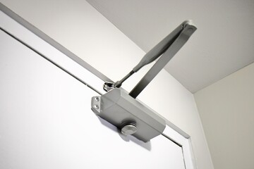 Automatic hydraulic door closer close up view
