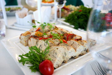 Stuffed chicken on a banquet table