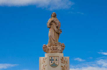 Naklejka premium Statue of the Virgin Mary (Mother Mary) in a park in Dili City, Timor Leste.