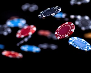 Casino chips falling mid-air with dramatic lighting on a black background