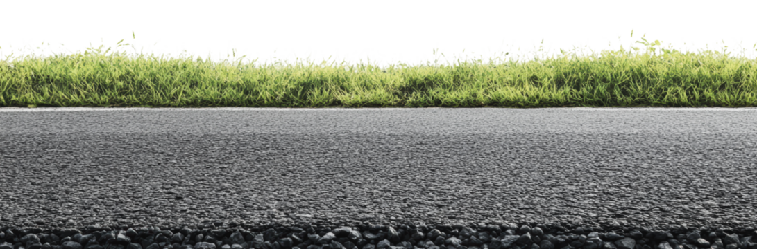 Grass along a freshly paved road in daylight, cut out - stock png.