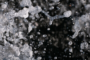 Close-up of water droplets frozen mid-air, creating abstract patterns