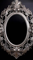 Ornate silver baroque frame with intricate floral patterns and elegant scrollwork on a deep black background