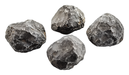 Natural black stones arranged on a white surface, cut out - stock png.