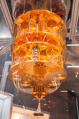 Close-Up View of a Quantum Computer Processor with Intricate Gold Wiring and Components