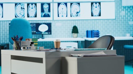 Empty medical office with computers and diagnostic tools set up for professional consultations, x...