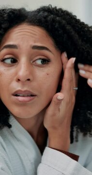 Skincare, bathroom and woman with wrinkles in home check for acne, breakout or zit on face. Natural, beauty and female person with inspection for frown lines with anti aging facial routine at house.