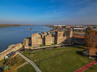 Fototapeta premium Ancient fortress Smederevo on the banks of the Danube in Serbia - drone aerial shot