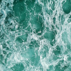 Fototapeta premium Aerial view of green ocean water with splashes and foam for abstract natural background and texture