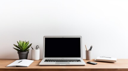 minimalist workspace with laptop and office supplies