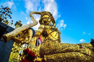 Golde Thai Angel statue ,at Wat Phra That Hariphunchai Lamphun Northern Thailand,South East Asia,Symbols of Buddhism