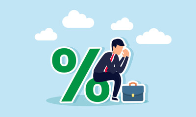 A businessman sits on a percentage symbol looking sad, illustration of disappointment over an unsatisfactory company revenue dividend percentage