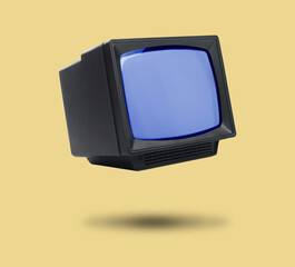 Retro TV set in air on pale orange background
