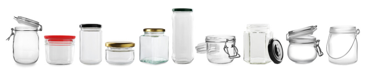 Set of many different glass jars isolated on white