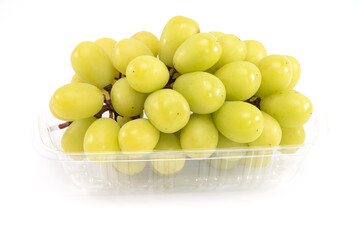 Shine muscat grape in plastic tray isolated on white background. Sweet green grape.