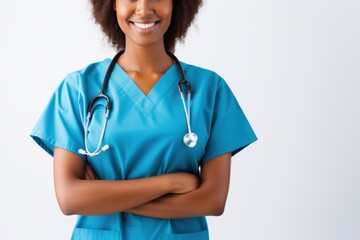 smiling healthcare professional in scrubs with stethoscope