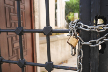 A Secured Gate featuring a Padlock and Chain for enhanced protection and safety measures