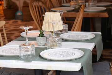 An Elegant Restaurant Table Setting Featuring Beautiful and Decorative Elements and Accents