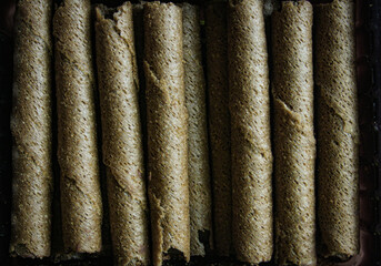 Chocolate wafer rolls texture background