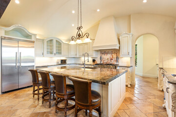 Modern kitchen design features elegant island and high-end appliances